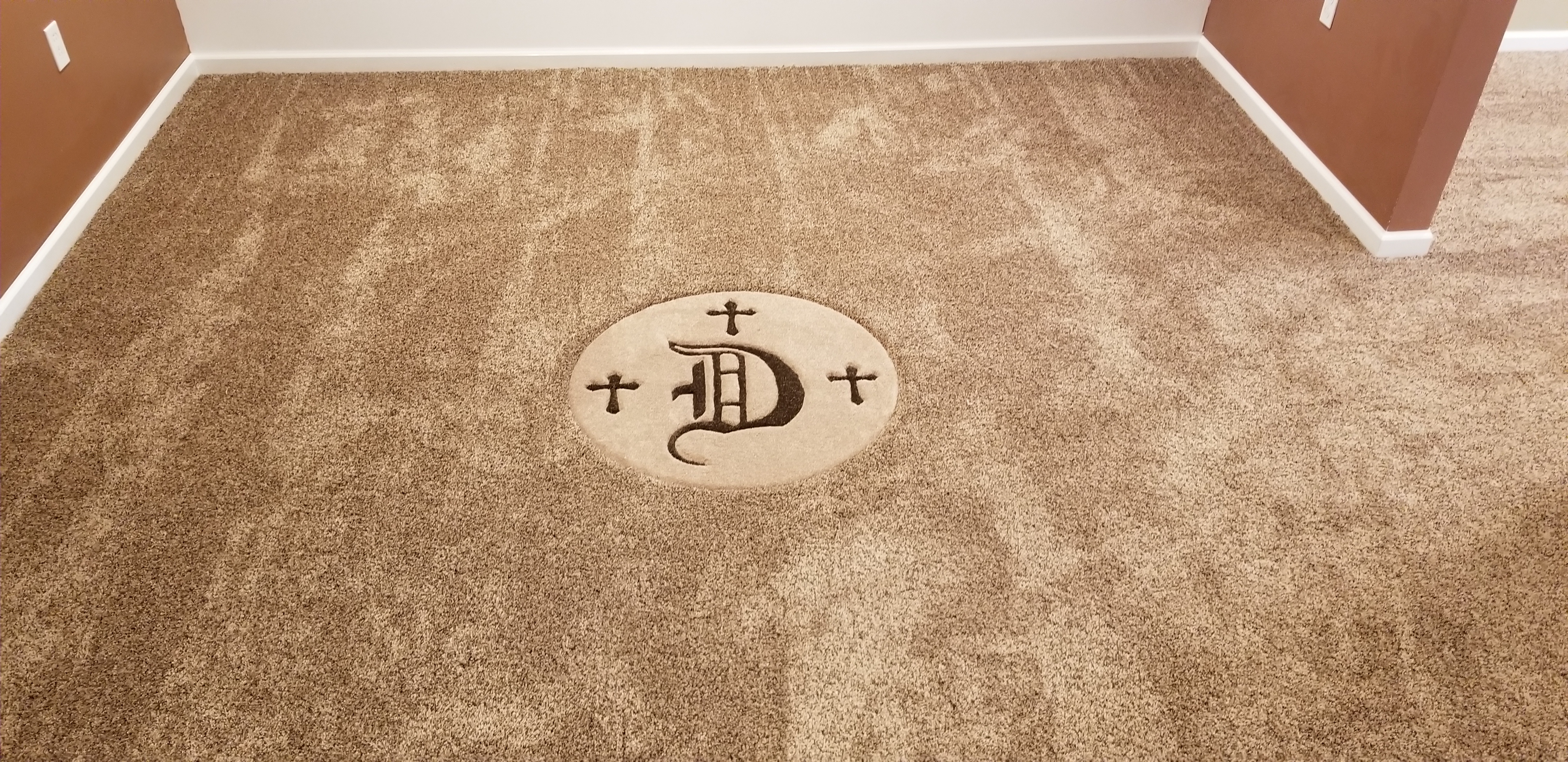 A carpet with the letter d on it