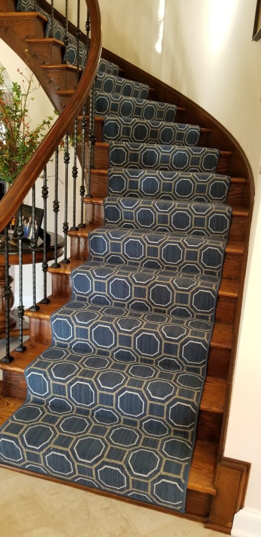 A staircase with blue carpet on the bottom of each step.