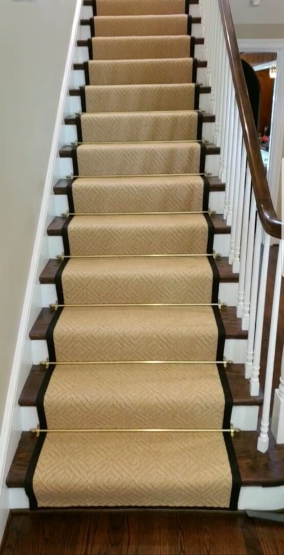 A staircase with carpet on the bottom of each step.